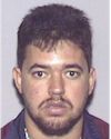 Face photo of male fugitive Julio Antonio Lopez