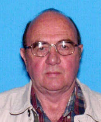Face photo of male fugitive Douglas J. Warner