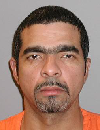 Face photo of male fugitive Perez Maximo