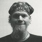 Male fugitive Jay Gardner Jordan with a scarf on head