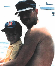 Bill Degan and his son fishing at the docks at Boston Harbor