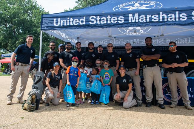 U.S. Marshals Service deputies with kids during National…