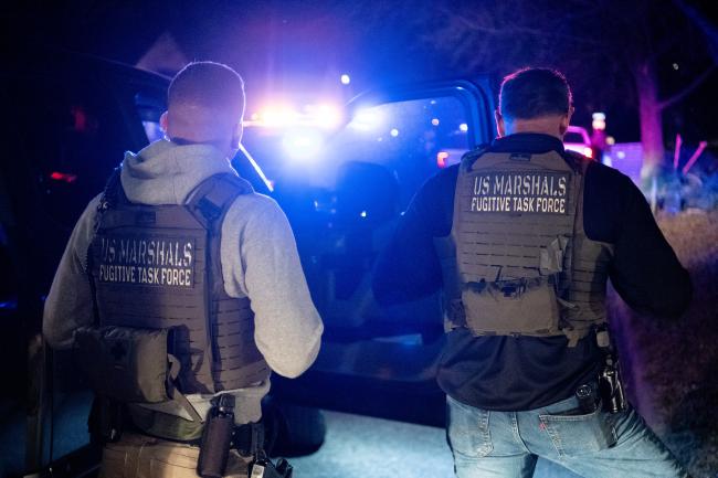 Two U.S. Marshals fugitive task force at duty night time