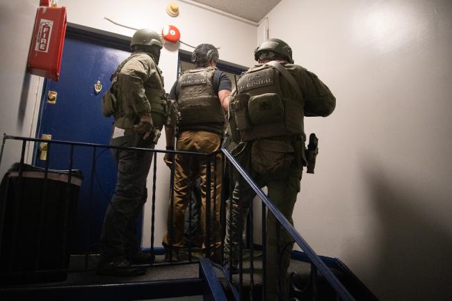 Deputy U.S. Marshals at residence during Operation North…