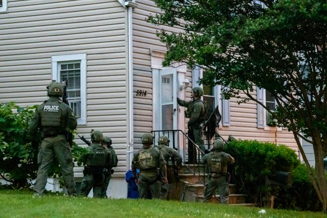 Deputy U.S. Marshals at a residence during Operation North…