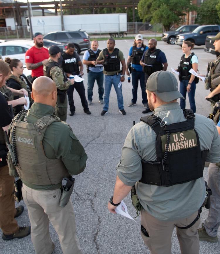Male and female US Marshals team