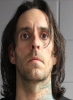 Face photo of male fugitive Jonah Sebastian Couturier